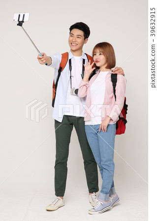 Happy young traveler couple concept photo. set out on a trip to honeymoon, camping and summer vacation concept isolated on white background. 199 Happy young traveler couple concept photo. set out on a trip to honeymoon, camping and summer vacation concept isolated on white background. 199 39632915