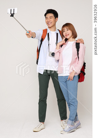 Happy young traveler couple concept photo. set out on a trip to honeymoon, camping and summer vacation concept isolated on white background. 200 Happy young traveler couple concept photo. set out on a trip to honeymoon, camping and summer vacation concept isolated on white background. 200 39632916