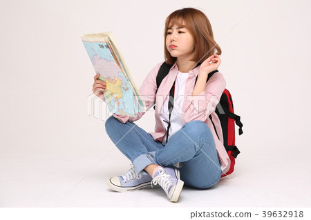 Young traveler woman with a backpack concept isolated on White photo. 126 Young traveler woman with a backpack concept isolated on White photo. 126 39632918