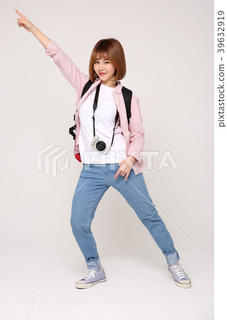 Young traveler woman with a backpack concept isolated on White photo. 040 Young traveler woman with a backpack concept isolated on White photo. 040 39632919