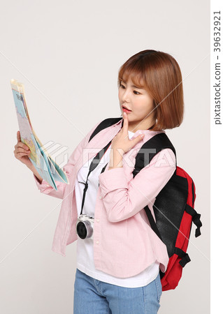 Young traveler woman with a backpack concept isolated on White photo. 114 Young traveler woman with a backpack concept isolated on White photo. 114 39632921