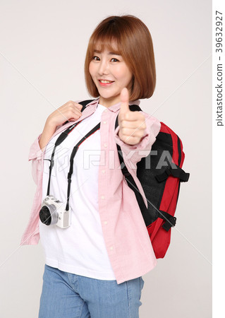 Young traveler woman with a backpack concept isolated on White photo. 037 Young traveler woman with a backpack concept isolated on White photo. 037 39632927
