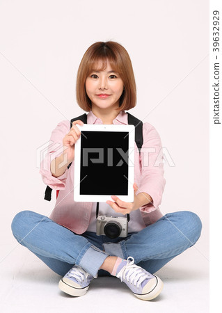 Young traveler woman with a backpack concept isolated on White photo. 111 Young traveler woman with a backpack concept isolated on White photo. 111 39632929