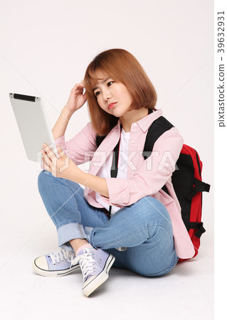 Young traveler woman with a backpack concept isolated on White photo. 110 Young traveler woman with a backpack concept isolated on White photo. 110 39632931