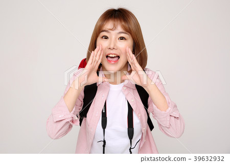 Young traveler woman with a backpack concept isolated on White photo. 028 Young traveler woman with a backpack concept isolated on White photo. 028 39632932