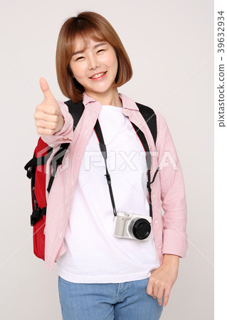 Young traveler woman with a backpack concept isolated on White photo. 033 Young traveler woman with a backpack concept isolated on White photo. 033 39632934