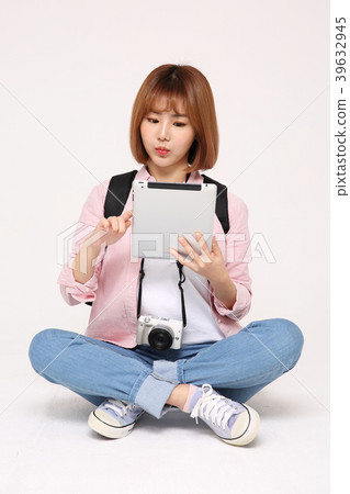 Young traveler woman with a backpack concept isolated on White photo. 105 Young traveler woman with a backpack concept isolated on White photo. 105 39632945