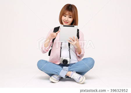 Young traveler woman with a backpack concept isolated on White photo. 104 Young traveler woman with a backpack concept isolated on White photo. 104 39632952