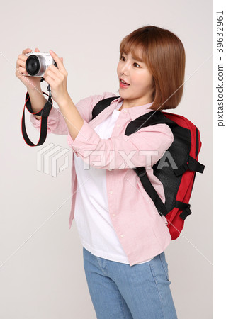 Young traveler woman with a backpack concept isolated on White photo. 071 39632961