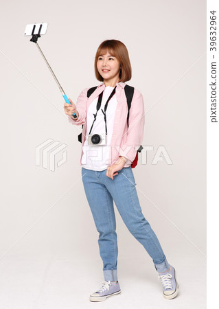 Young traveler woman with a backpack concept isolated on White photo. 065 Young traveler woman with a backpack concept isolated on White photo. 065 39632964