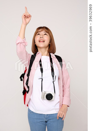 Young traveler woman with a backpack concept isolated on White photo. 053 Young traveler woman with a backpack concept isolated on White photo. 053 39632969