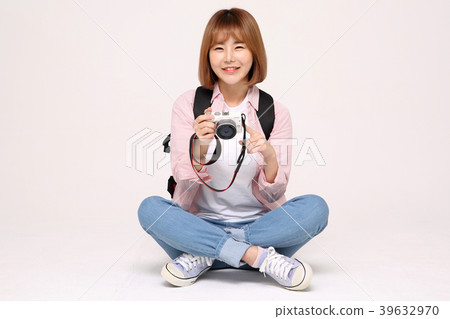 Young traveler woman with a backpack concept isolated on White photo. 076 Young traveler woman with a backpack concept isolated on White photo. 076 39632970