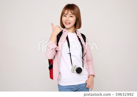 Young traveler woman with a backpack concept isolated on White photo. 030 Young traveler woman with a backpack concept isolated on White photo. 030 39632992