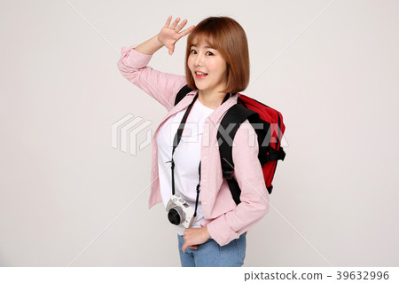 Young traveler woman with a backpack concept isolated on White photo. 020 Young traveler woman with a backpack concept isolated on White photo. 020 39632996