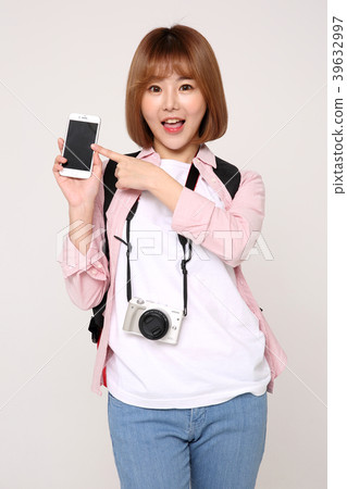 Young traveler woman with a backpack concept isolated on White photo. 060 Young traveler woman with a backpack concept isolated on White photo. 060 39632997