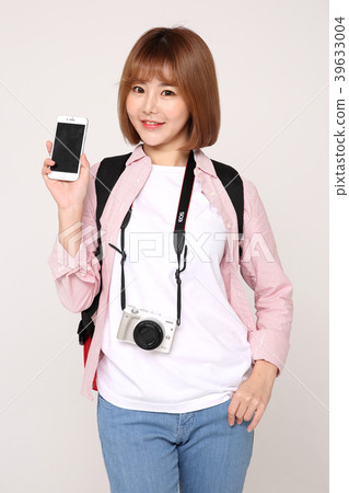 Young traveler woman with a backpack concept isolated on White photo. 059 Young traveler woman with a backpack concept isolated on White photo. 059 39633004