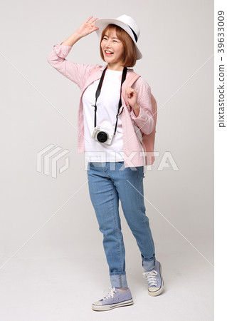 Young traveler woman with a backpack concept isolated on White photo. 004 Young traveler woman with a backpack concept isolated on White photo. 004 39633009