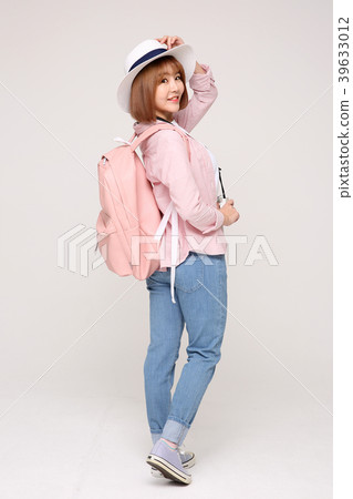 Young traveler woman with a backpack concept isolated on White photo. 008 Young traveler woman with a backpack concept isolated on White photo. 008 39633012