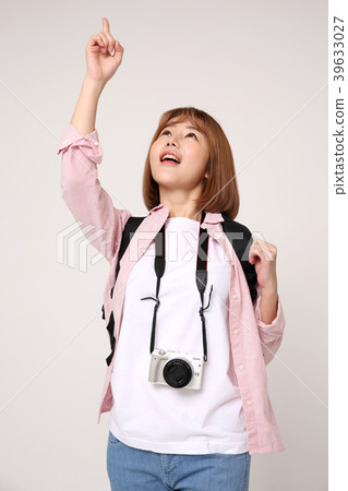 Young traveler woman with a backpack concept isolated on White photo. 054 Young traveler woman with a backpack concept isolated on White photo. 054 39633027