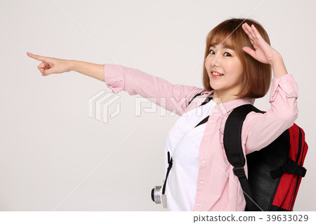 Young traveler woman with a backpack concept isolated on White photo. 051 Young traveler woman with a backpack concept isolated on White photo. 051 39633029