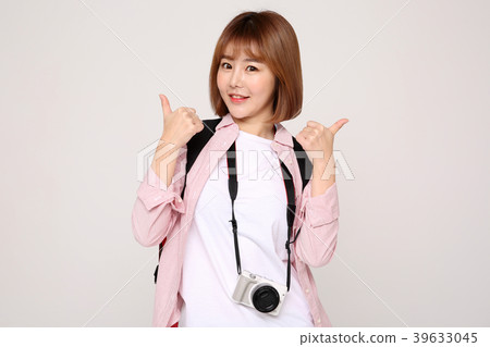 Young traveler woman with a backpack concept isolated on White photo. 031 Young traveler woman with a backpack concept isolated on White photo. 031 39633045