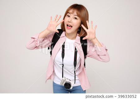 Young traveler woman with a backpack concept isolated on White photo. 025 Young traveler woman with a backpack concept isolated on White photo. 025 39633052