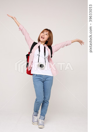 Young traveler woman with a backpack concept isolated on White photo. 023 Young traveler woman with a backpack concept isolated on White photo. 023 39633053