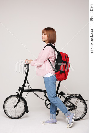 Young traveler woman with a backpack concept isolated on White photo. 135 Young traveler woman with a backpack concept isolated on White photo. 135 39633056