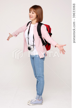 Young traveler woman with a backpack concept isolated on White photo. 019 Young traveler woman with a backpack concept isolated on White photo. 019 39633068