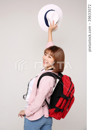 Young traveler woman with a backpack concept isolated on White photo. 017 Young traveler woman with a backpack concept isolated on White photo. 017 39633072