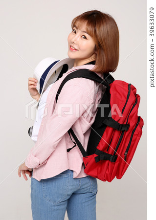 Young traveler woman with a backpack concept isolated on White photo. 016 Young traveler woman with a backpack concept isolated on White photo. 016 39633079