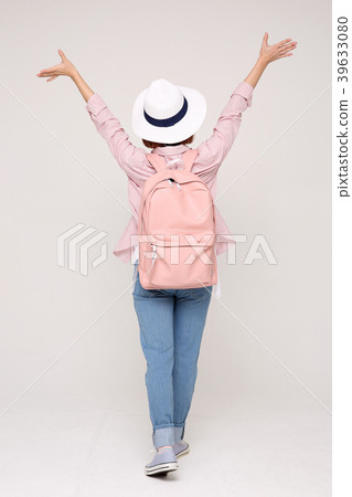 Young traveler woman with a backpack concept isolated on White photo. 010 Young traveler woman with a backpack concept isolated on White photo. 010 39633080