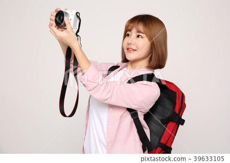 Young traveler woman with a backpack concept isolated on White photo. 070 Young traveler woman with a backpack concept isolated on White photo. 070 39633105