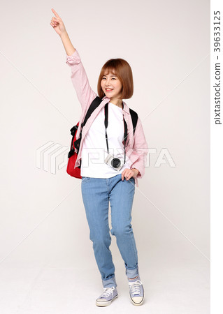 Young traveler woman with a backpack concept isolated on White photo. 039 Young traveler woman with a backpack concept isolated on White photo. 039 39633125