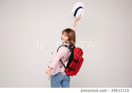 Young traveler woman with a backpack concept isolated on White photo. 015 Young traveler woman with a backpack concept isolated on White photo. 015 39633129