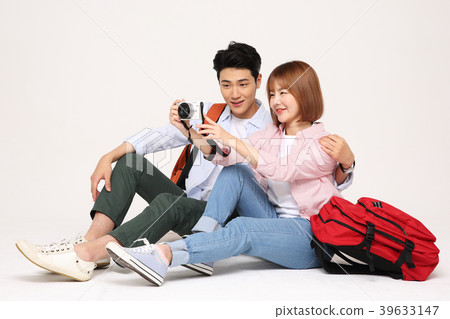 Happy young traveler couple concept photo. set out on a trip to honeymoon, camping and summer vacation concept isolated on white background. 202 Happy young traveler couple concept photo. set out on a trip to honeymoon, camping and summer vacation concept isolated on white background. 202 39633147