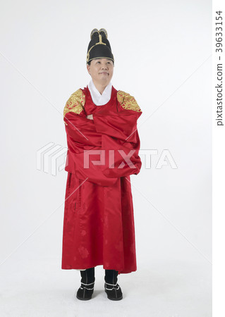 A middle-aged man who dressed a king's clothes making funny expression photo. 276 39633154