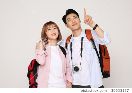 Happy young traveler couple concept photo. set out on a trip to honeymoon, camping and summer vacation concept isolated on white background. 188 Happy young traveler couple concept photo. set out on a trip to honeymoon, camping and summer vacation concept isolated on white background. 188 39633157