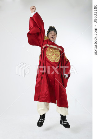 A middle-aged man who dressed a king's clothes making funny expression photo. 308 39633180