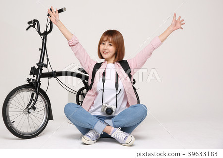 Young traveler woman with a backpack concept isolated on White photo. 146 Young traveler woman with a backpack concept isolated on White photo. 146 39633183