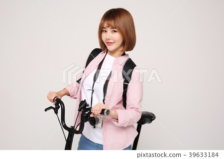 Young traveler woman with a backpack concept isolated on White photo. 140 Young traveler woman with a backpack concept isolated on White photo. 140 39633184