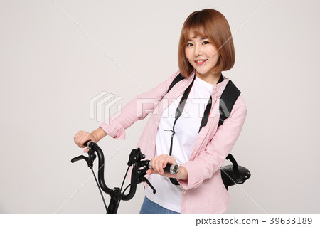 Young traveler woman with a backpack concept isolated on White photo. 141 Young traveler woman with a backpack concept isolated on White photo. 141 39633189