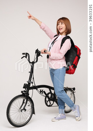 Young traveler woman with a backpack concept isolated on White photo. 138 Young traveler woman with a backpack concept isolated on White photo. 138 39633191