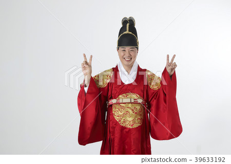 A middle-aged man who dressed a king's clothes making funny expression photo. 298 39633192