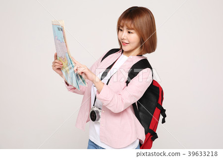 Young traveler woman with a backpack concept isolated on White photo. 115 Young traveler woman with a backpack concept isolated on White photo. 115 39633218