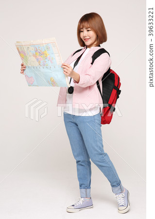 Young traveler woman with a backpack concept isolated on White photo. 123 Young traveler woman with a backpack concept isolated on White photo. 123 39633221