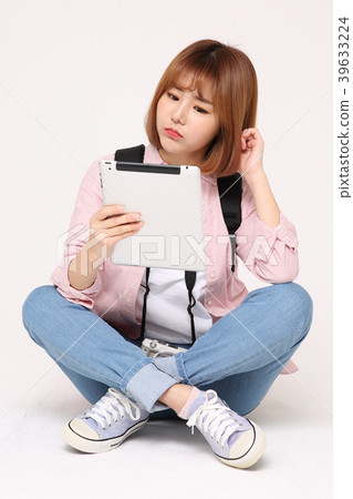Young traveler woman with a backpack concept isolated on White photo. 107 Young traveler woman with a backpack concept isolated on White photo. 107 39633224