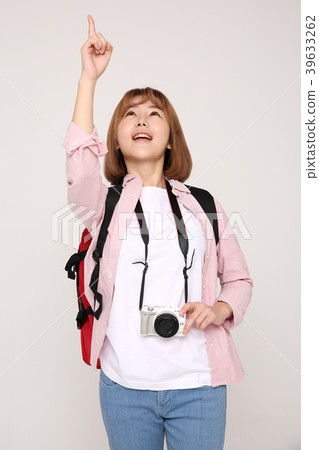 Young traveler woman with a backpack concept isolated on White photo. 055 Young traveler woman with a backpack concept isolated on White photo. 055 39633262