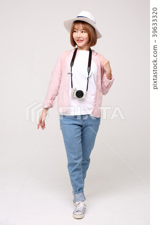 Young traveler woman with a backpack concept isolated on White photo. 003 Young traveler woman with a backpack concept isolated on White photo. 003 39633320