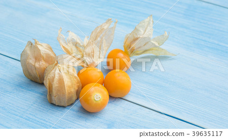 Cape gooseberry on a blue wooden table. Cape gooseberry on a blue wooden table. 39635117